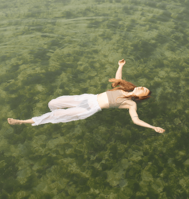 Women floating in a natural pool.